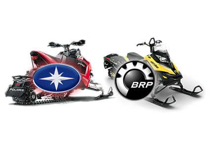 Polaris and Bombardier snowmobiles side-by-side.