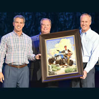 Three men making a boy scout presentation