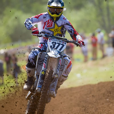 Christophe Pourcel racing on moto track. 