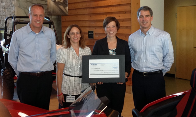 L-R Bennett Morgan, Polaris President and COO; Sandy Judge – ALS Special Events Coordinator; Jen Hjelle – ALS Executive Director; Scott Wine – Polaris Chairman and CEO