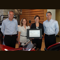 L-R Bennett Morgan, Polaris President and COO; Sandy Judge – ALS Special Events Coordinator; Jen Hjelle – ALS Executive Director; Scott Wine – Polaris Chairman and CEO