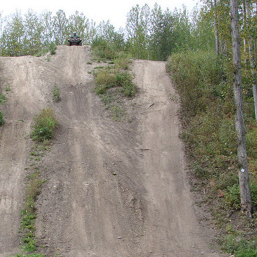 An AVT is sitting at the top of a steep hill, ready to make its decent.