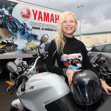 Vicki Gray sitting on her bike