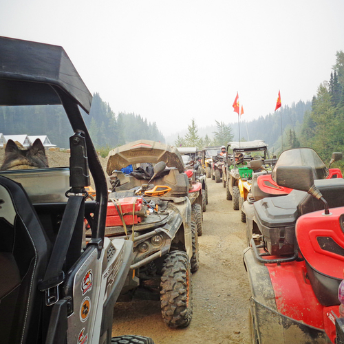 A long line of quads are ready to start a sunset ride.