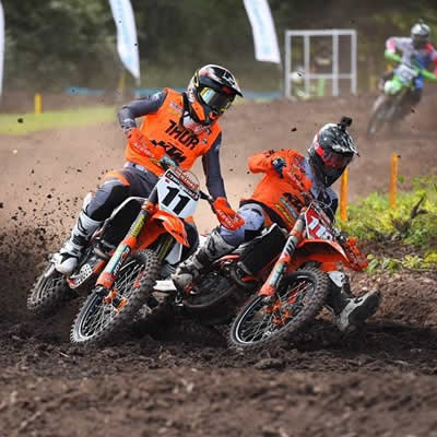 Kaven Benoit and Davi Millsaps are neck and neck as they round a corner on the mx track in New Brunswick. 