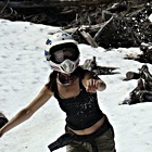 Lady wearing a helmet, in snowy weather