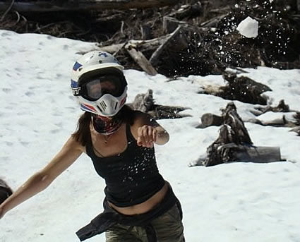 Lady wearing a helmet, in snowy weather