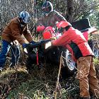 Photo of people pushing an ATV