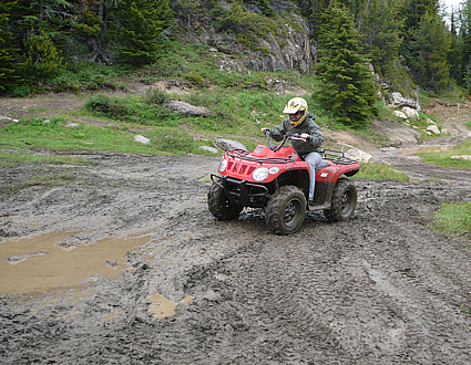 Kali Love heads into the mud mania pits near Panorama BC