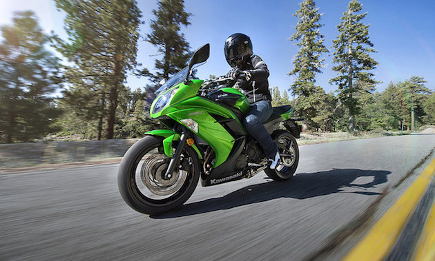 A Ninja 650 flying down a highway. 