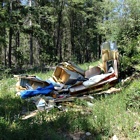 Garbage strewn about in the woods