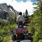 A man on an ATV observes his surroundings