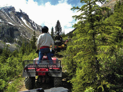 A man on an ATV observes his surroundings