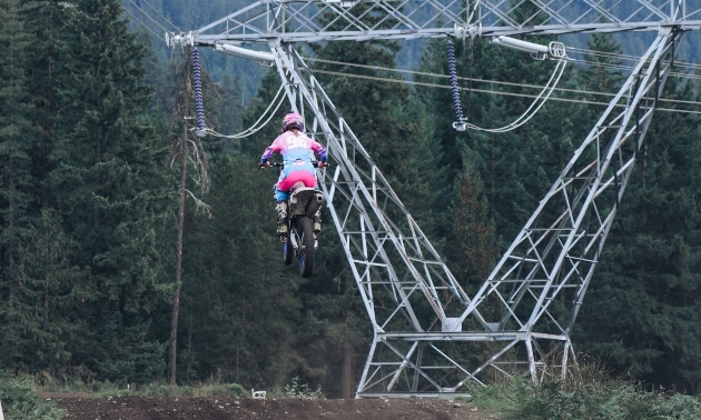 Lucia catching air on her dirt bike