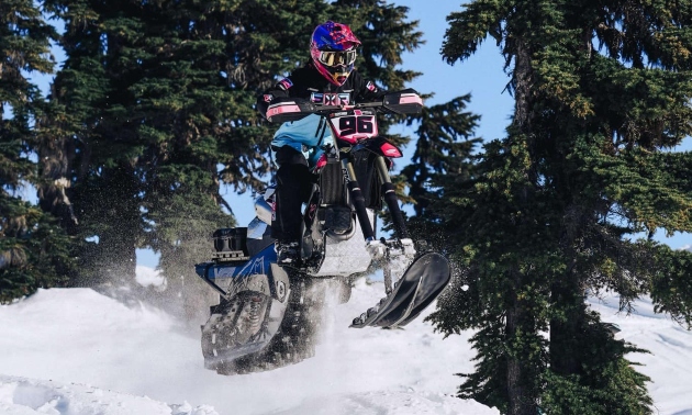 Lucia riding a snowbike