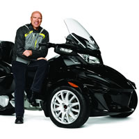 Mark Messier sitting on a black BRP Can-Am Spyder. 