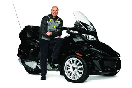 Mark Messier sitting on a black BRP Can-Am Spyder. 