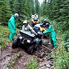 Photo of an ATV stuck in mud