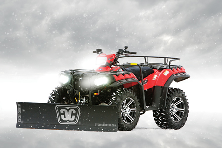 A red Sportsman quad with a snow plow on it. 