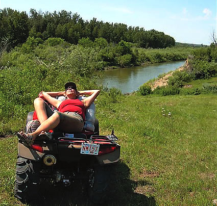 Lady lying on an ATV