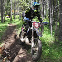 A man on an offroad bike. 