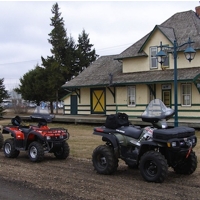 4 Quads in front of the old rail station at Smoky Lake. 