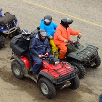 An aerial shot of a group of ATVers getting ready for a ride. 