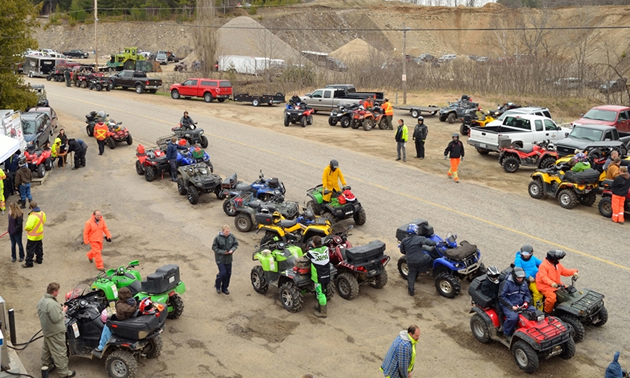 An aerial shot of a group of ATVers getting ready for a ride. 