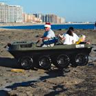 Photo of an Argo being driven on a beach