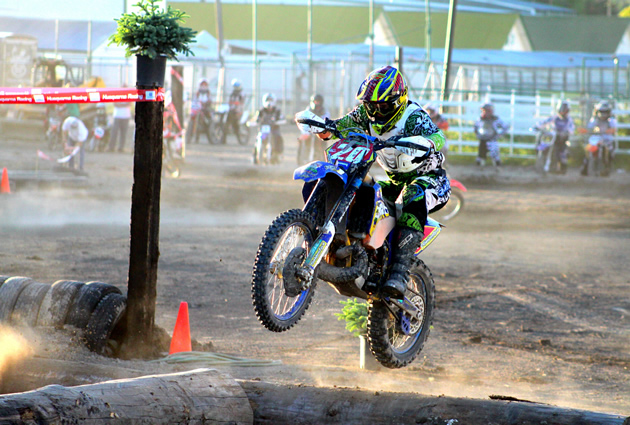 Shane Cuthbertson Riding  his Husaberg TE 300 on endurocross course. 