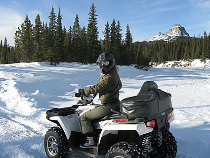 Photo of someone ATVing over snow