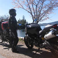 TV actor Gabe Khouth standing by his Ducati Monster. 