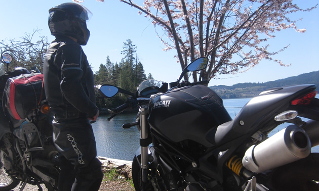 TV actor Gabe Khouth standing by his Ducati Monster. 