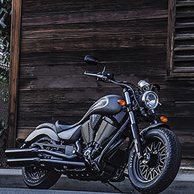 Two black and grey Victory motorcycles. 