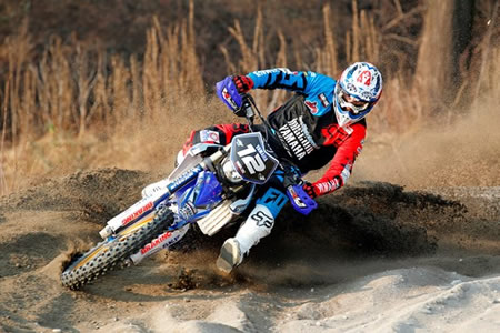 Yamaha enduro racer banking a corner.  